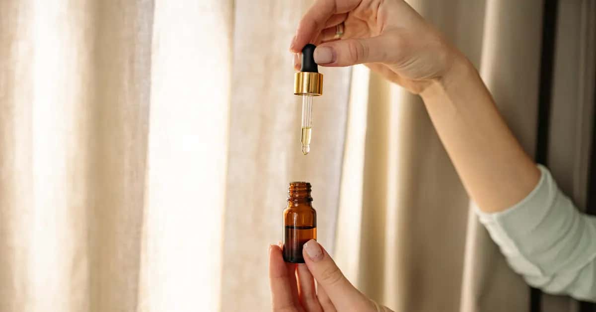 Cannabis tincture bottle with dropper for sublingual dosing.