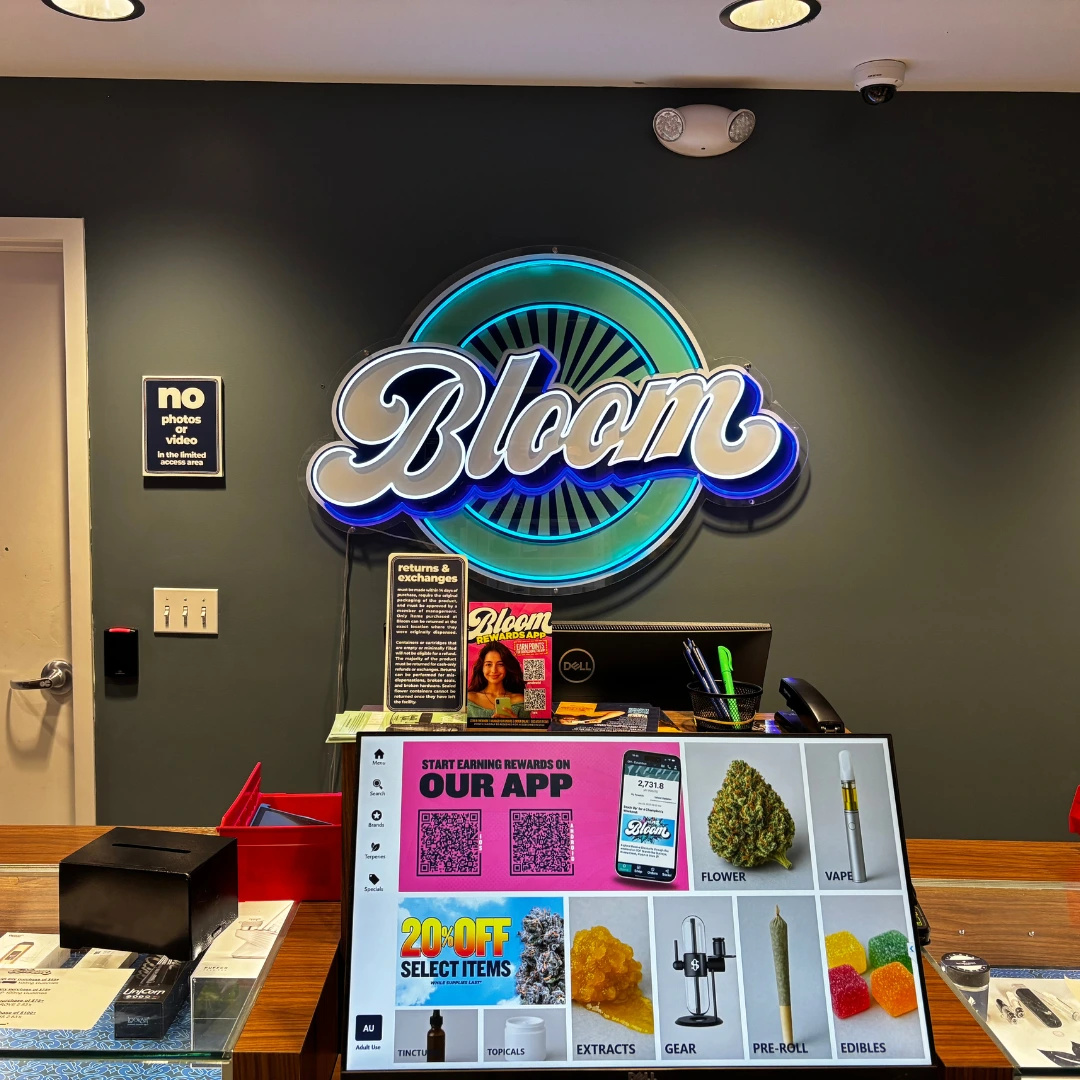 Bloom cannabis dispensary in Painesville Ohio instore counter with menu screen displaying recreational cannabis products available for purchase