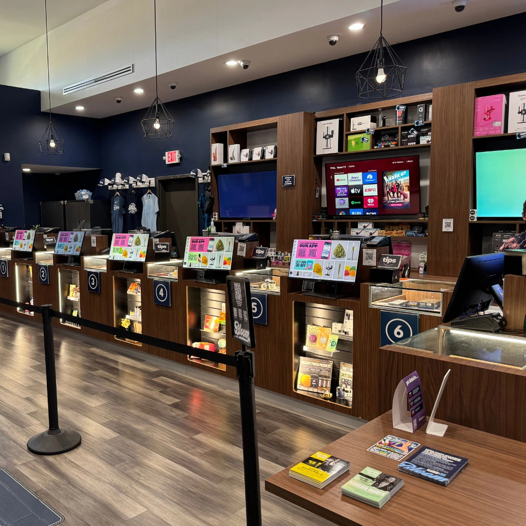 Bloom marijuana Seven Mile dispensary accessory wall behind counters with grinders, vaporizers, rolling papers and more on shelf